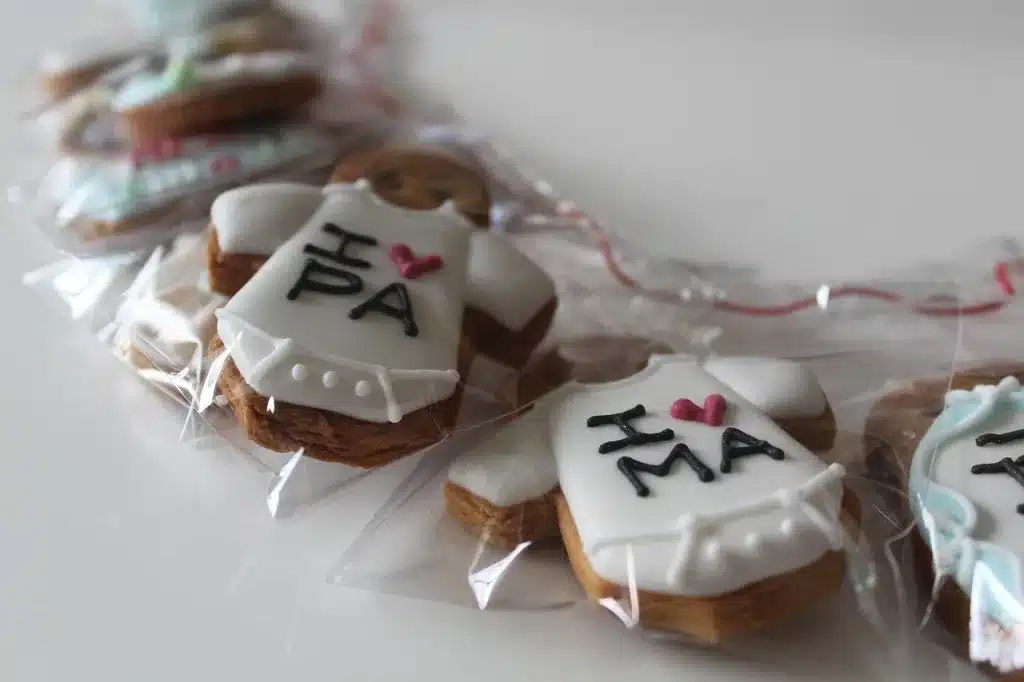Decorated biscuits wrapped in flexible plastic film packaging demonstrating common types of food packaging for baked goods.